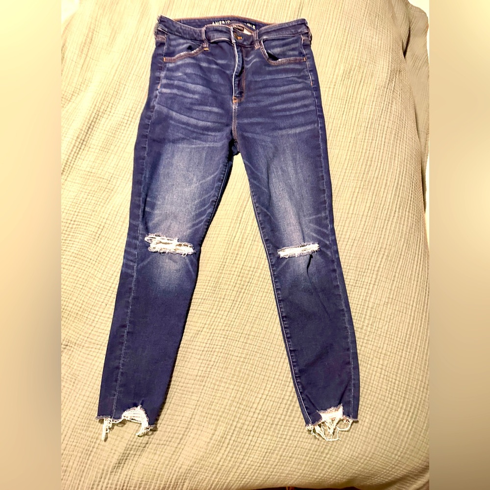 Women’s American Eagle size 14 short, dark wash, distressed hem jeans.